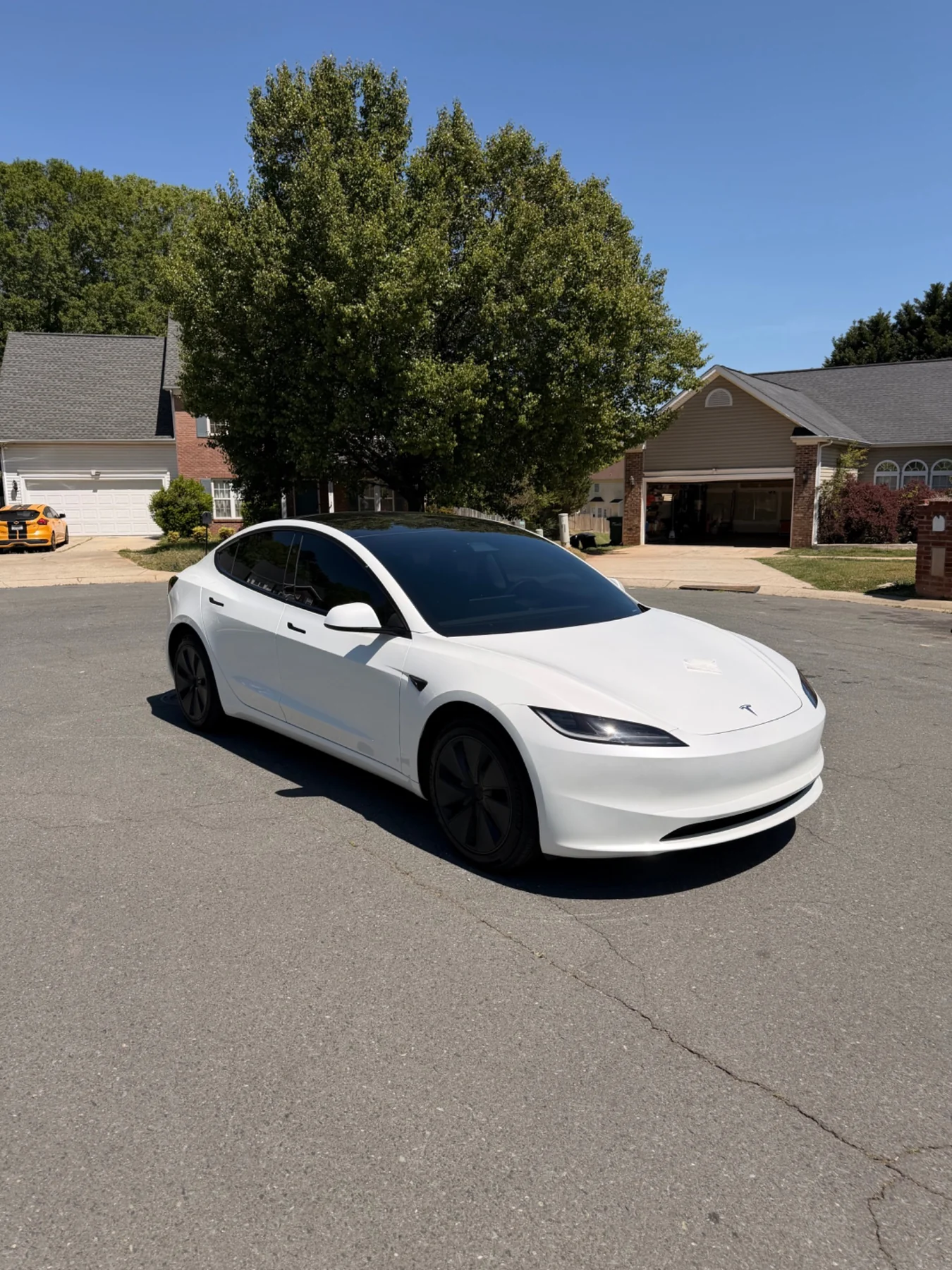 White Tesla Model 3 with clean dark ceramic window tint